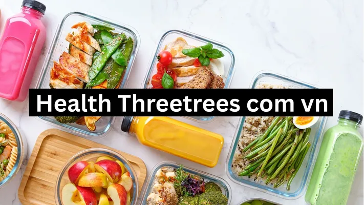 A top-down view of several glass meal prep containers filled with healthy food, including grilled chicken, vegetables, fruit, and pasta salad, surrounded by colorful juice bottles on a white marble background.
